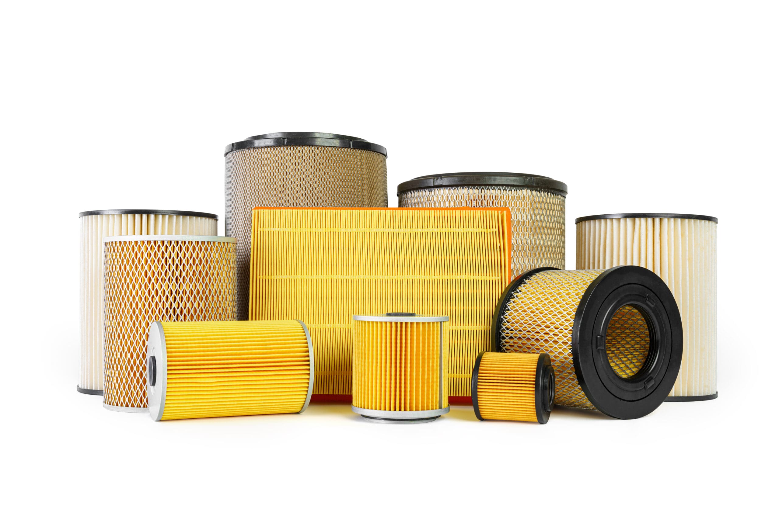 Assorted yellow pleated air filters with mesh and rubber ends for industrial filtration applications